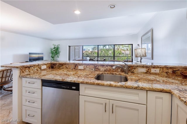 kitchen with dishwasher, kitchen peninsula, light stone counters, and sink