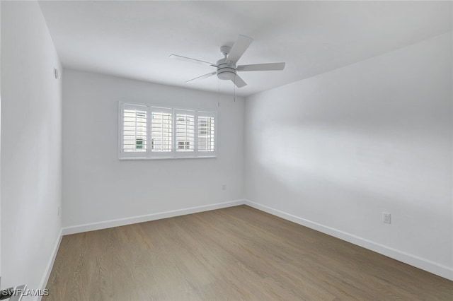 unfurnished room featuring ceiling fan and light hardwood / wood-style flooring