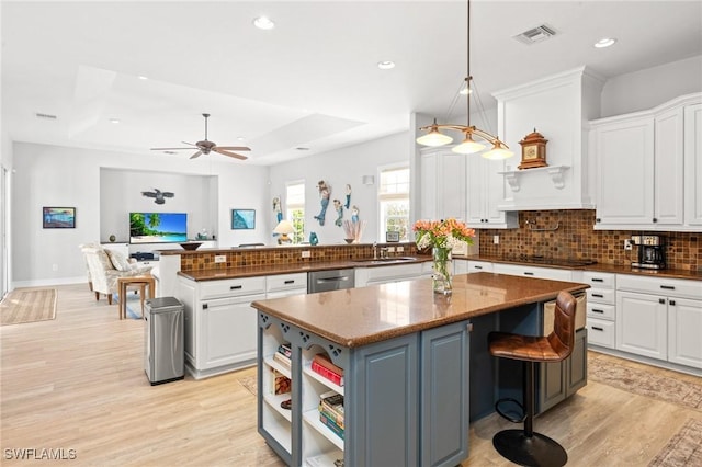 kitchen featuring white cabinets and a center island