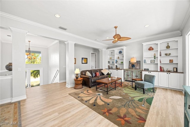 living room featuring light hardwood / wood-style flooring, ceiling fan, and ornamental molding