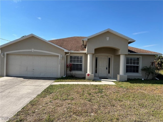 ranch-style house with a front lawn and a garage