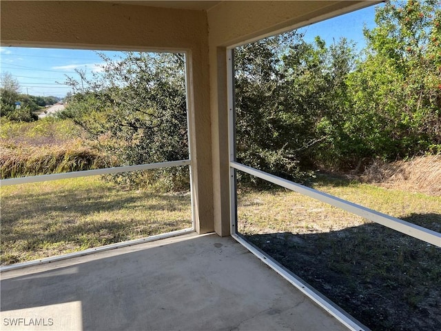 unfurnished sunroom with a wealth of natural light