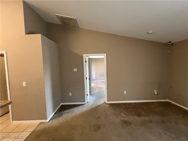 spare room with light colored carpet