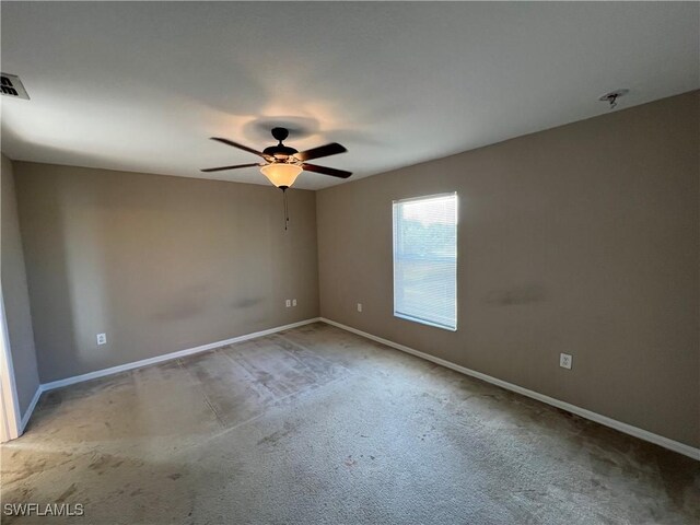 unfurnished room with carpet floors and ceiling fan