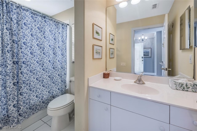 bathroom with curtained shower, an inviting chandelier, tile patterned floors, toilet, and vanity