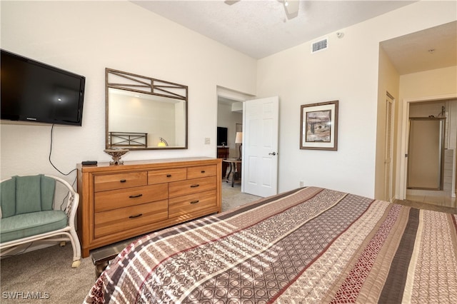 bedroom featuring ceiling fan, a closet, and carpet floors