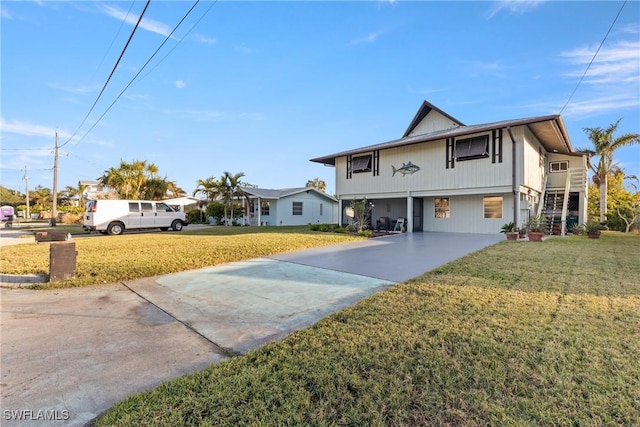 front of property featuring a front yard and a carport