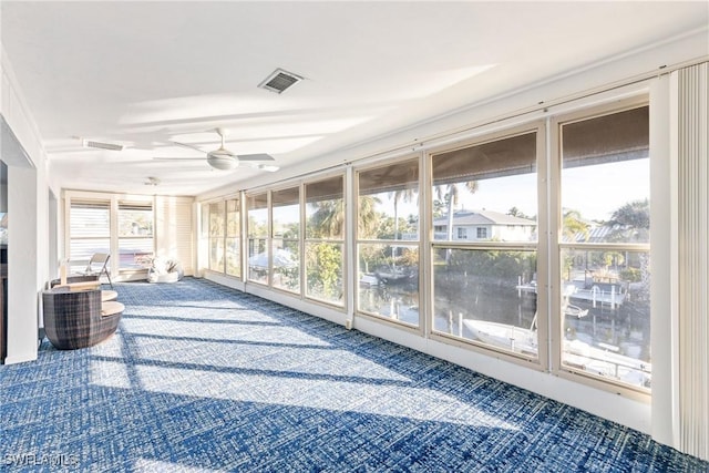 sunroom with ceiling fan and a healthy amount of sunlight