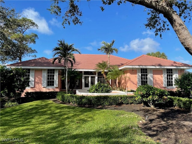 single story home featuring a front yard