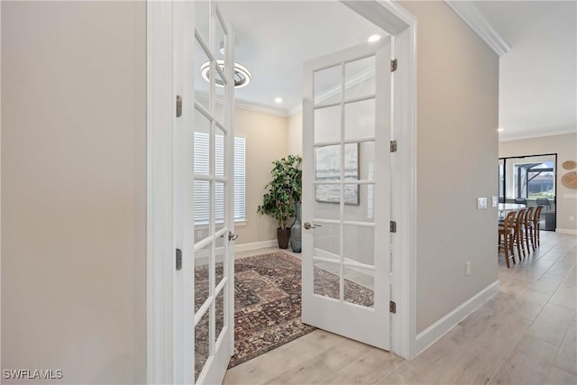 interior space featuring hardwood / wood-style flooring, french doors, and ornamental molding