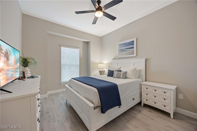 bedroom with ceiling fan and light wood-type flooring