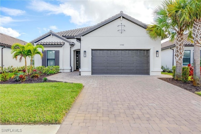 mediterranean / spanish-style home featuring a garage