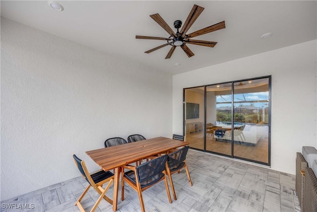 dining room with heating unit and ceiling fan