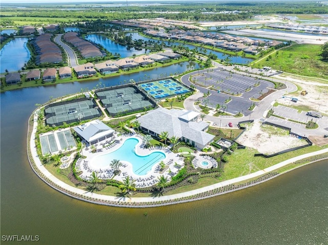 birds eye view of property with a water view