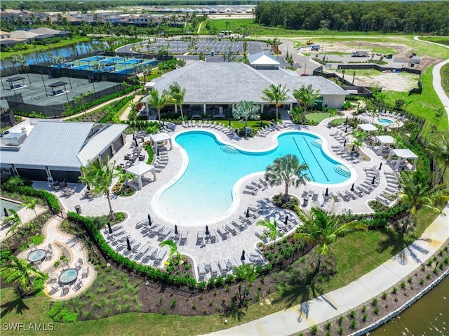 birds eye view of property with a water view