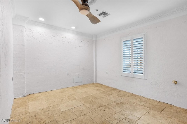 unfurnished room featuring ceiling fan and crown molding