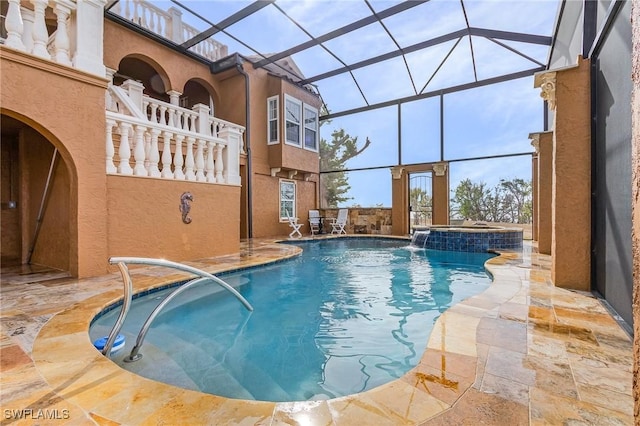 view of swimming pool with pool water feature, glass enclosure, an in ground hot tub, and a patio