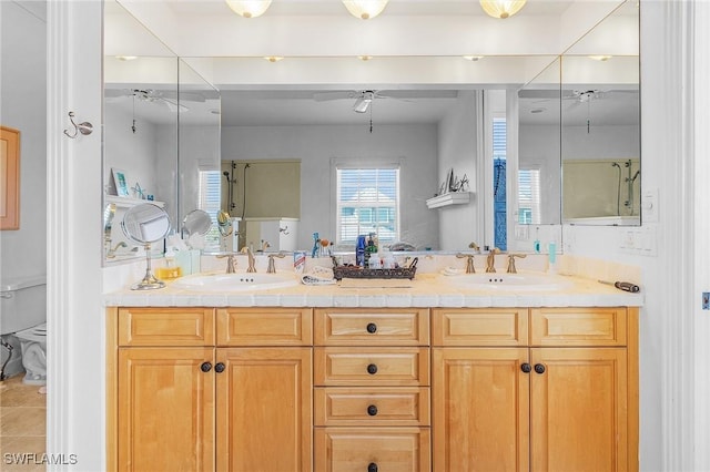 bathroom featuring tile patterned floors, ceiling fan, toilet, and vanity