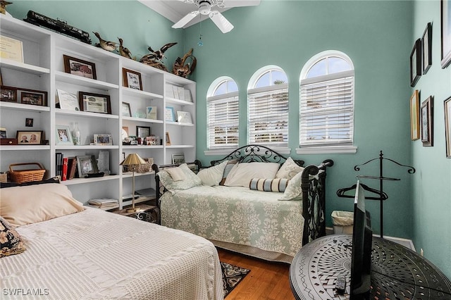 bedroom featuring hardwood / wood-style flooring and ceiling fan