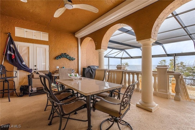 dining area with ceiling fan and french doors