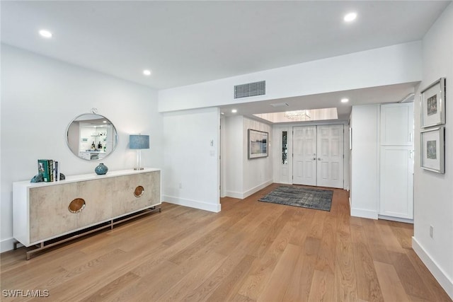 entrance foyer with light hardwood / wood-style flooring