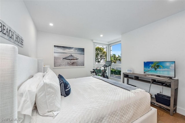 bedroom with hardwood / wood-style floors