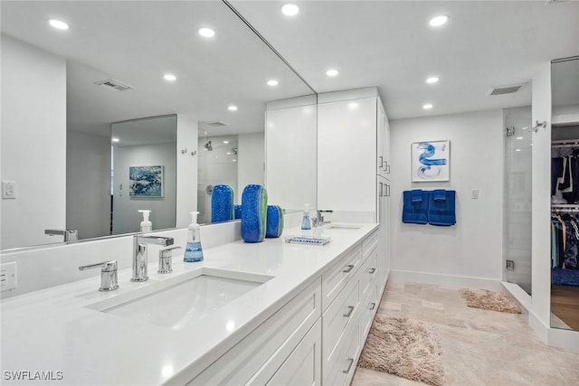 bathroom with vanity and walk in shower