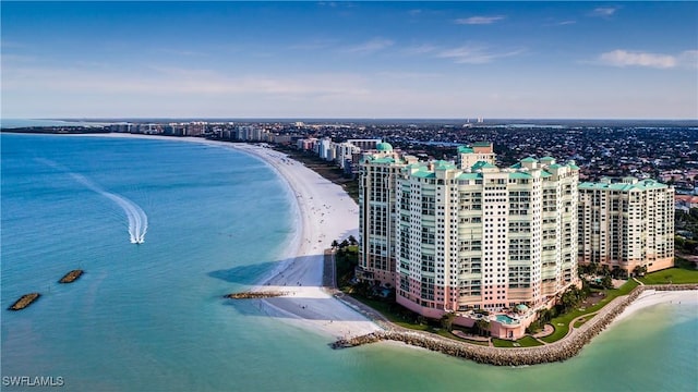 birds eye view of property with a beach view, a water view, and a view of city
