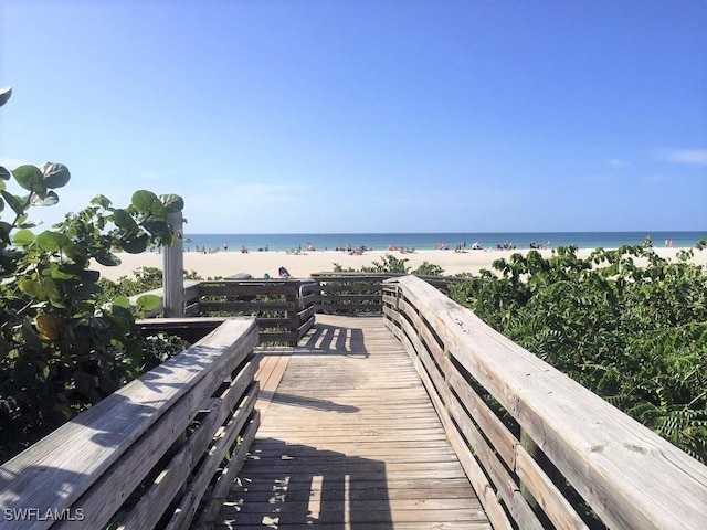 view of home's community featuring a view of the beach and a water view