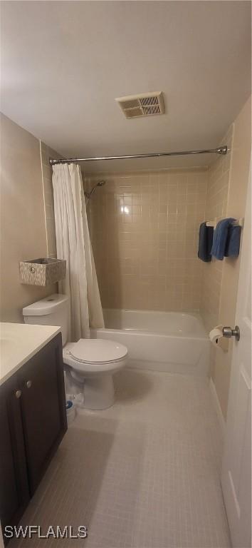 bathroom with vanity, tile patterned flooring, and toilet