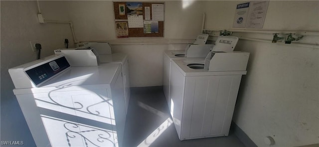 laundry room with separate washer and dryer