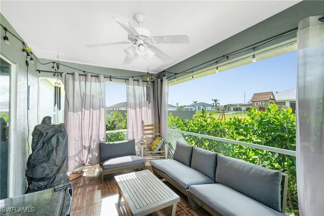 sunroom / solarium with ceiling fan