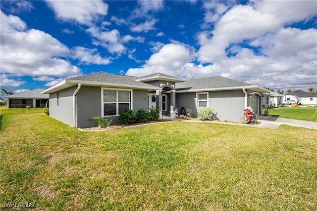 ranch-style home featuring a front yard and a garage