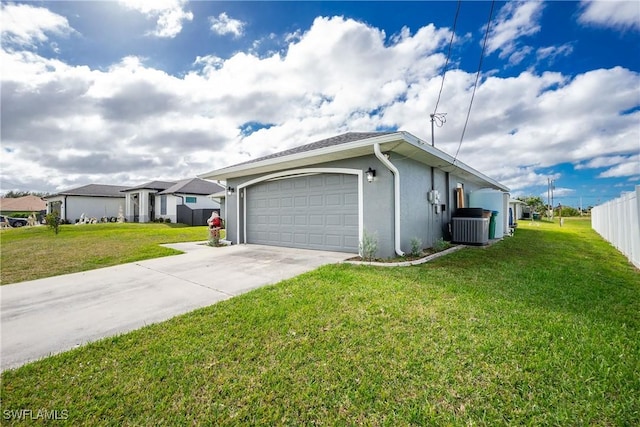 view of front of home with a front yard and central AC