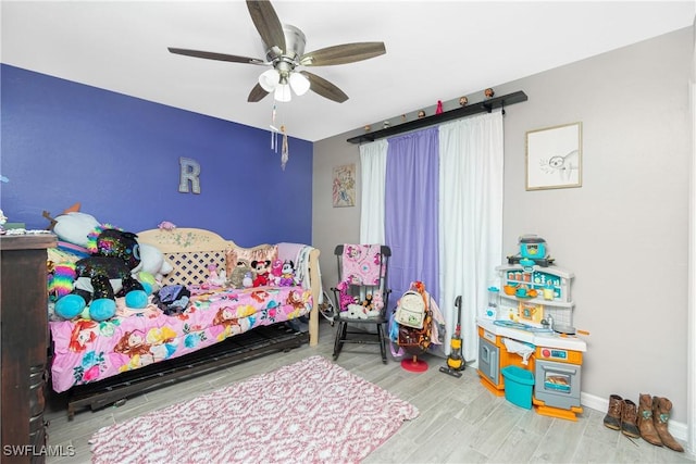 bedroom featuring ceiling fan and hardwood / wood-style floors