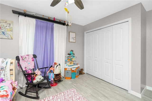 playroom featuring light hardwood / wood-style floors and ceiling fan