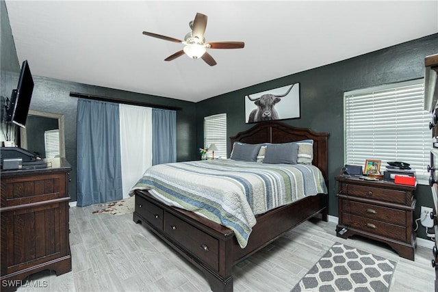 bedroom featuring light hardwood / wood-style flooring and ceiling fan