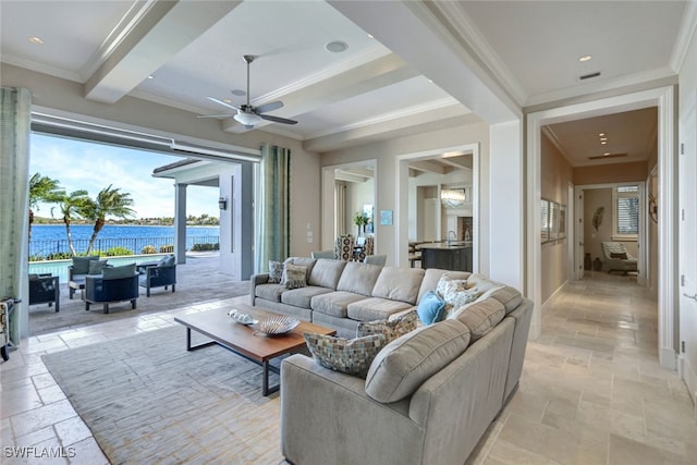 living room with beamed ceiling, ceiling fan, a water view, and crown molding