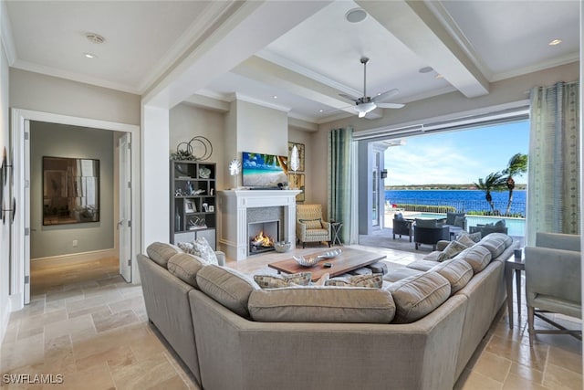 living room featuring ceiling fan, beamed ceiling, and ornamental molding