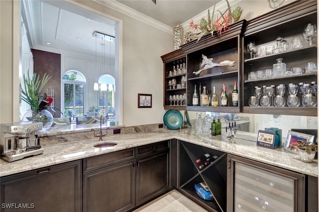 bar with light stone countertops, dark brown cabinets, wine cooler, and sink