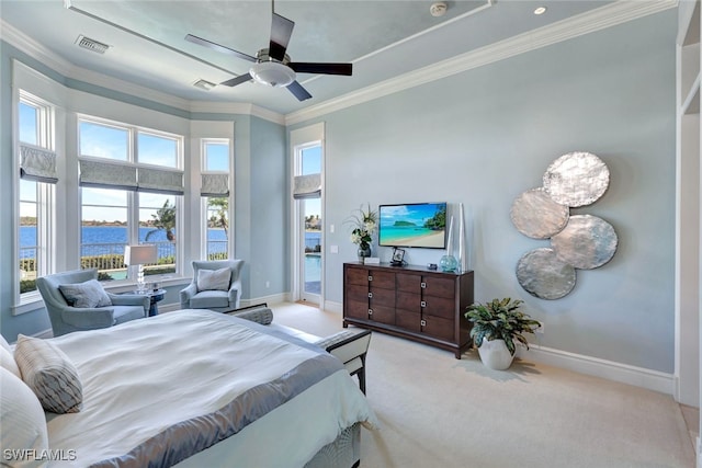 bedroom with ceiling fan, a water view, light colored carpet, and multiple windows