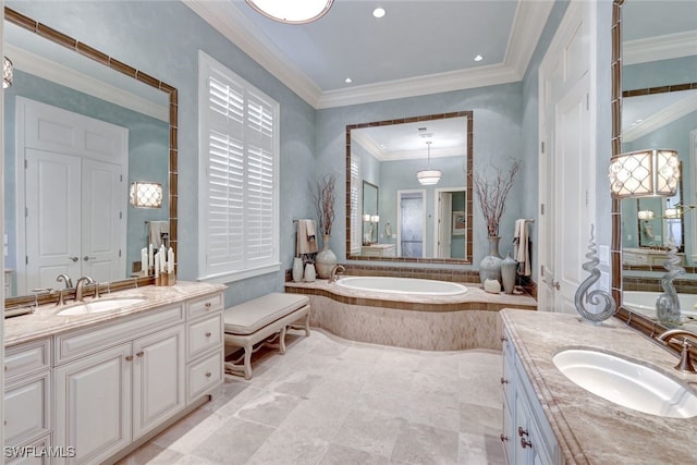 bathroom with vanity, crown molding, and a relaxing tiled tub