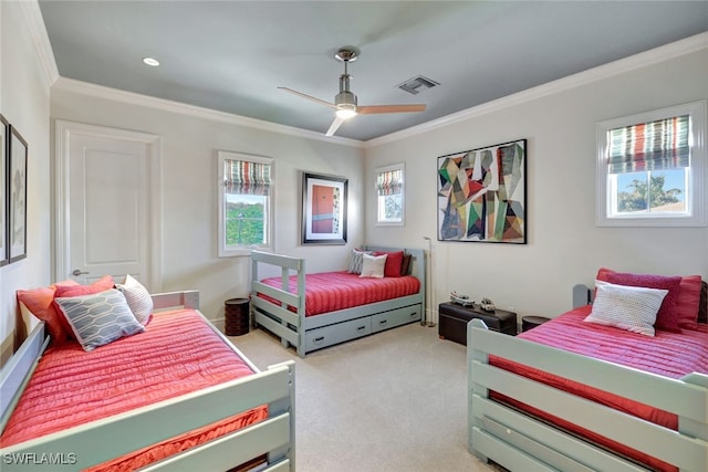 carpeted bedroom with ceiling fan and ornamental molding