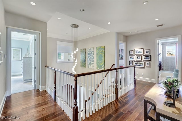 hall featuring crown molding and dark wood-type flooring