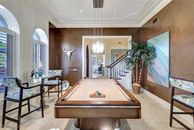 recreation room with ornamental molding, a notable chandelier, and billiards