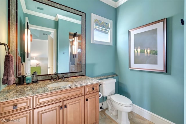 bathroom with tile patterned floors, crown molding, vanity, and toilet