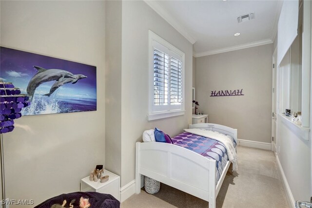 carpeted bedroom featuring crown molding