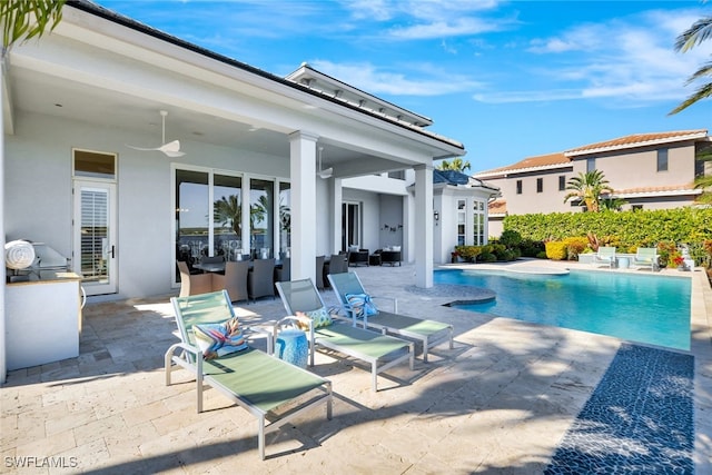 view of pool featuring ceiling fan and a patio area