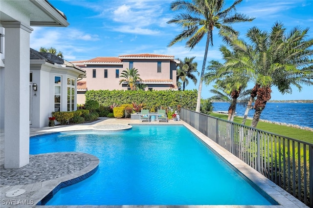 view of pool with a water view