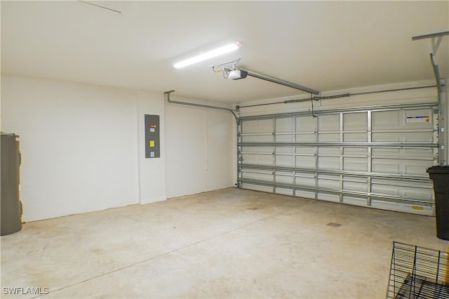 garage with electric panel, a garage door opener, and water heater